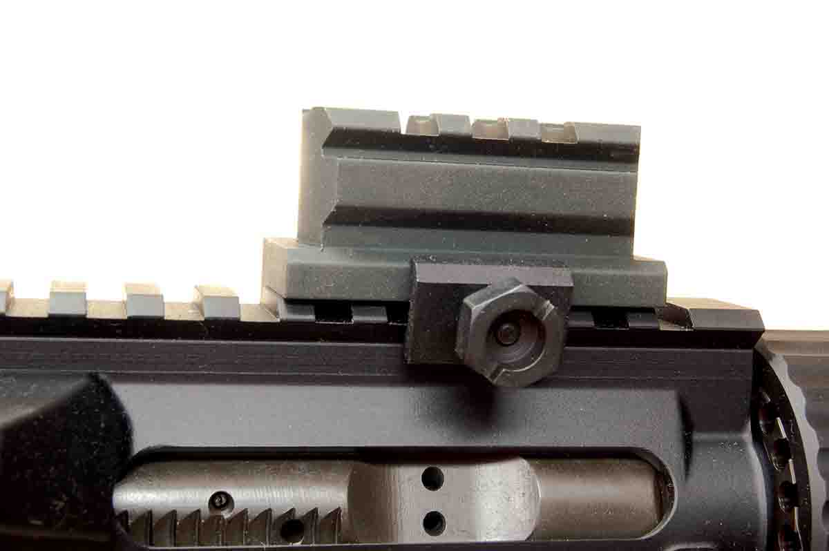 The riser block on an AR has a hex nut on a rail clamp, as do many such devices. The nut is half-inch or 13mm.